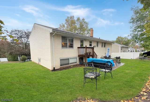 a white bench sitting in middle of the grass
