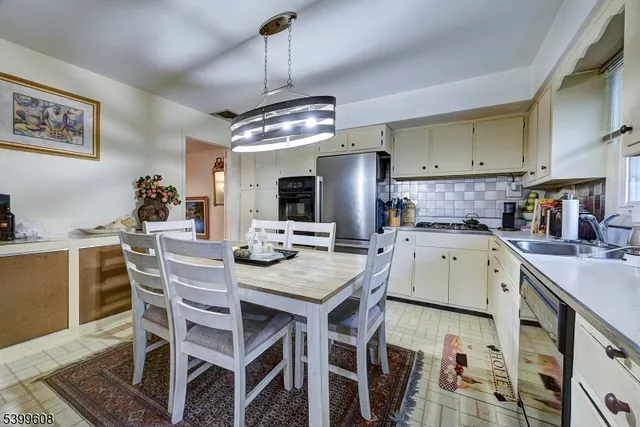 a kitchen that has a cabinets counter space and stainless steel appliances
