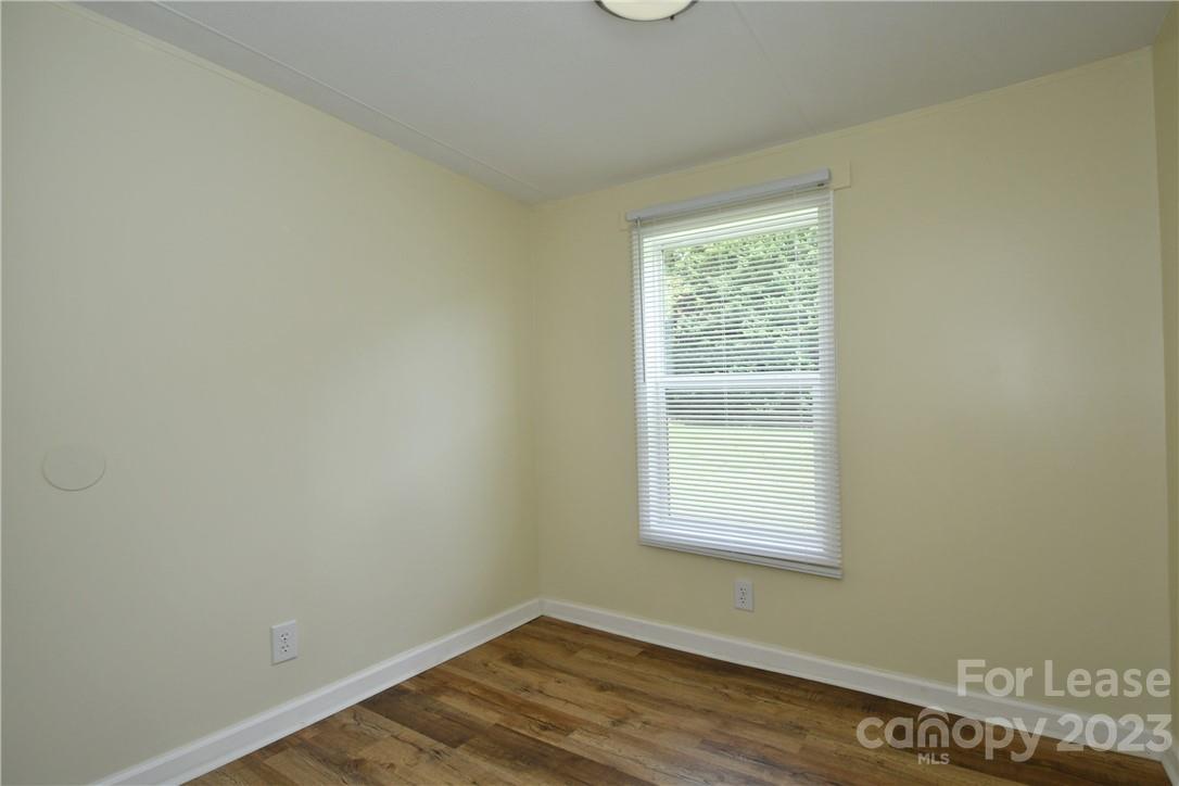 115 Buckhead Road, Unit 111 Harmony, NC 28634 - Photo 12 of 19 an empty room with a window