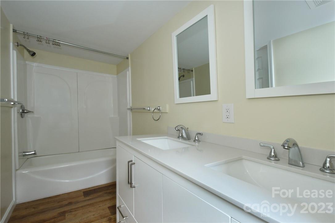 115 Buckhead Road, Unit 111 Harmony, NC 28634 - Photo 14 of 19 a bathroom with a sink and a bathtub