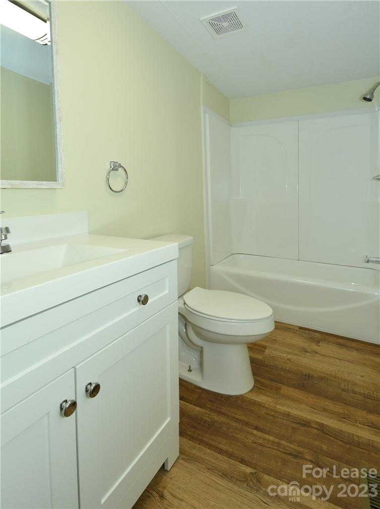 115 Buckhead Road, Unit 111 Harmony, NC 28634 - Photo 17 of 19 a bathroom with a toilet and a shower