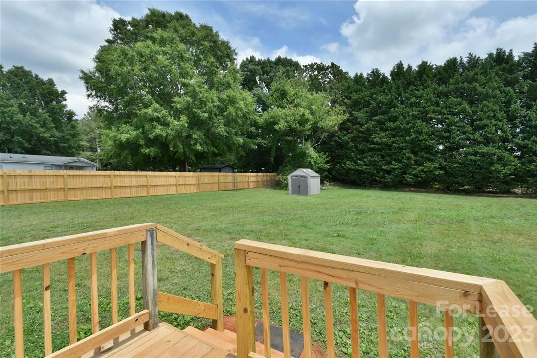 115 Buckhead Road, Unit 111 Harmony, NC 28634 - Photo 18 of 19 a view of outdoor space with deck and yard