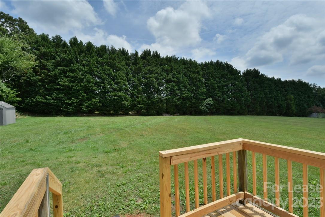 115 Buckhead Road, Unit 111 Harmony, NC 28634 - Photo 19 of 19 a view of a backyard with garden