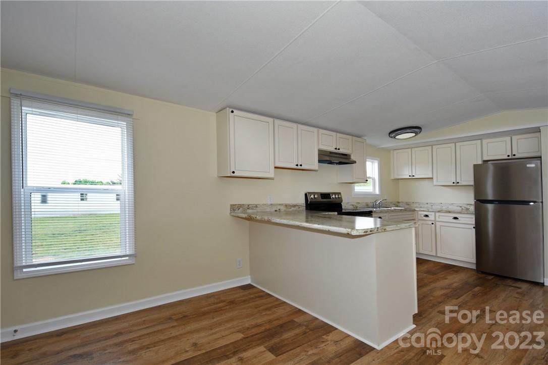 115 Buckhead Road, Unit 111 Harmony, NC 28634 - Photo 2 of 19 a kitchen with a sink a refrigerator and window