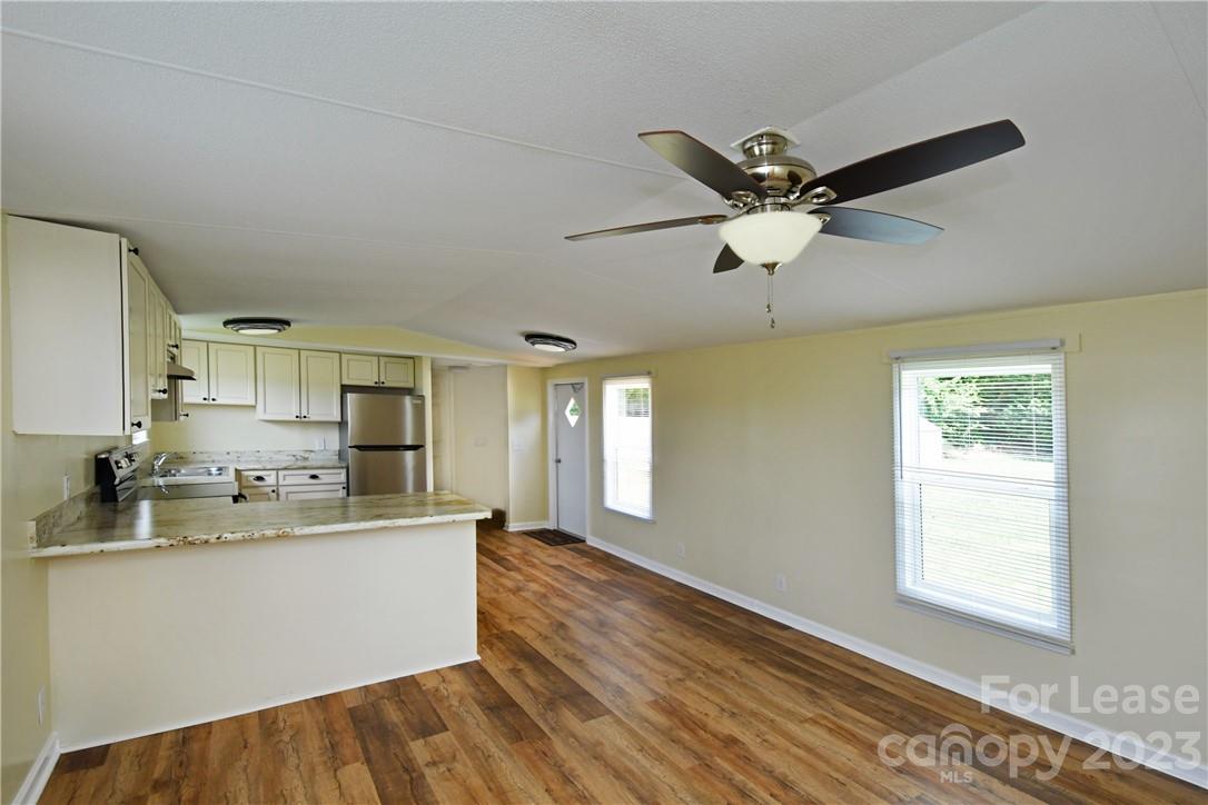 115 Buckhead Road, Unit 111 Harmony, NC 28634 - Photo 3 of 19 a kitchen with a sink cabinets and window