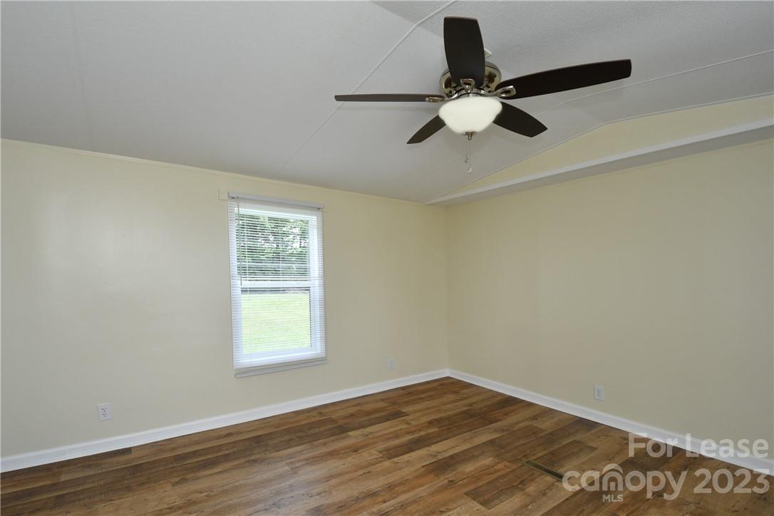 115 Buckhead Road, Unit 111 Harmony, NC 28634 - Photo 7 of 19 a view of empty room with wooden floor