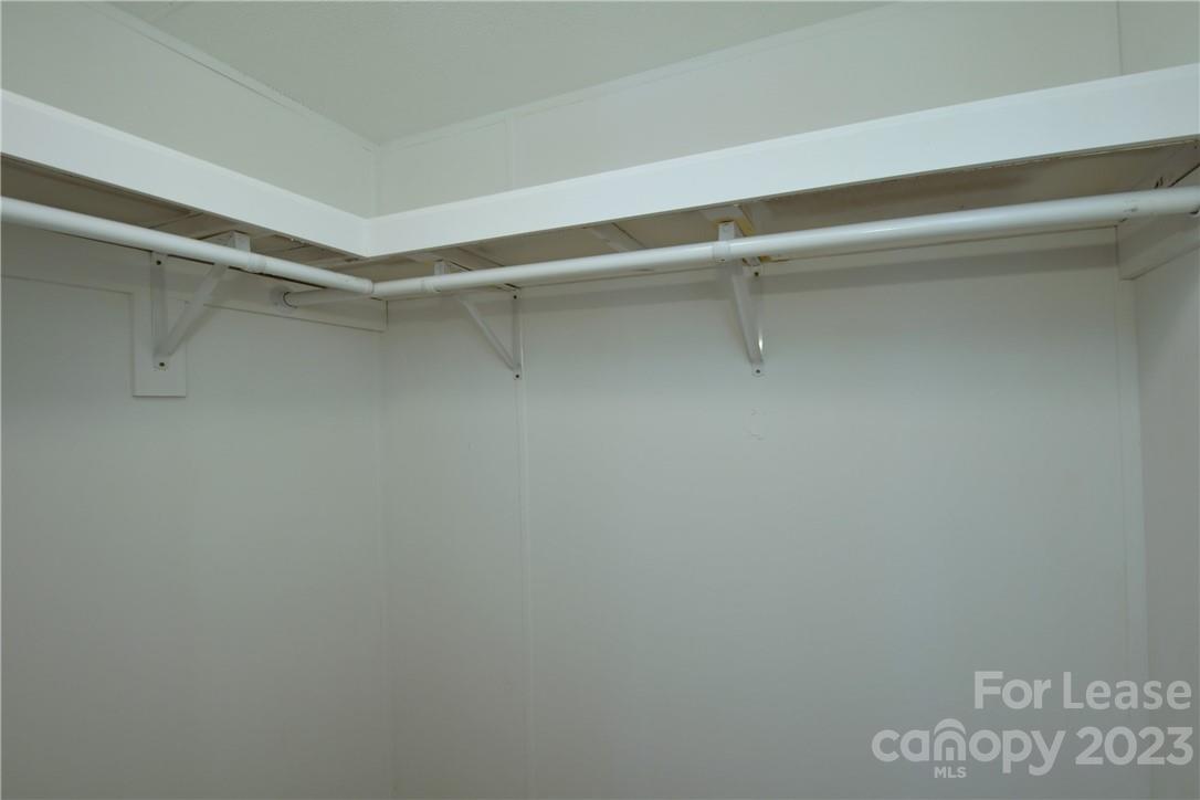 115 Buckhead Road, Unit 111 Harmony, NC 28634 - Photo 10 of 19 a view of a room with racks on the wall