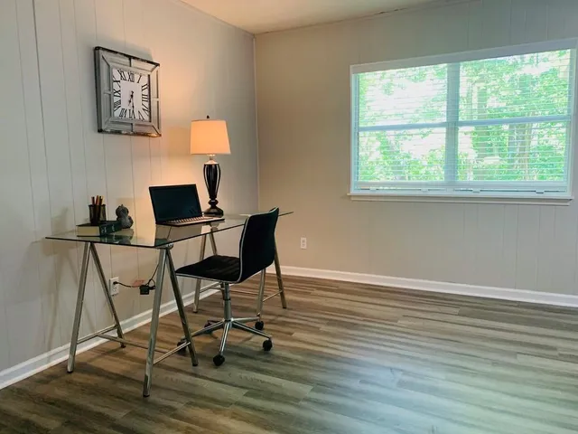 a work room with furniture and a window