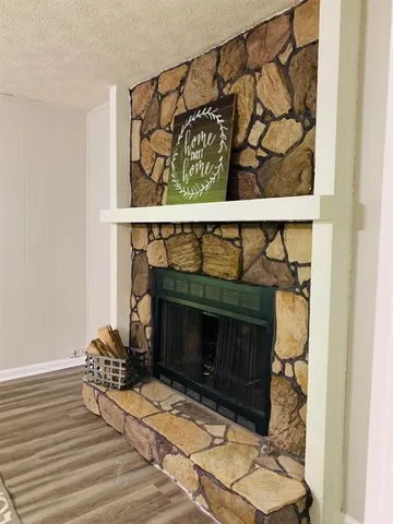 a fireplace with a clock on wall