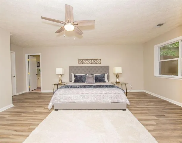 a large white bed in a white room