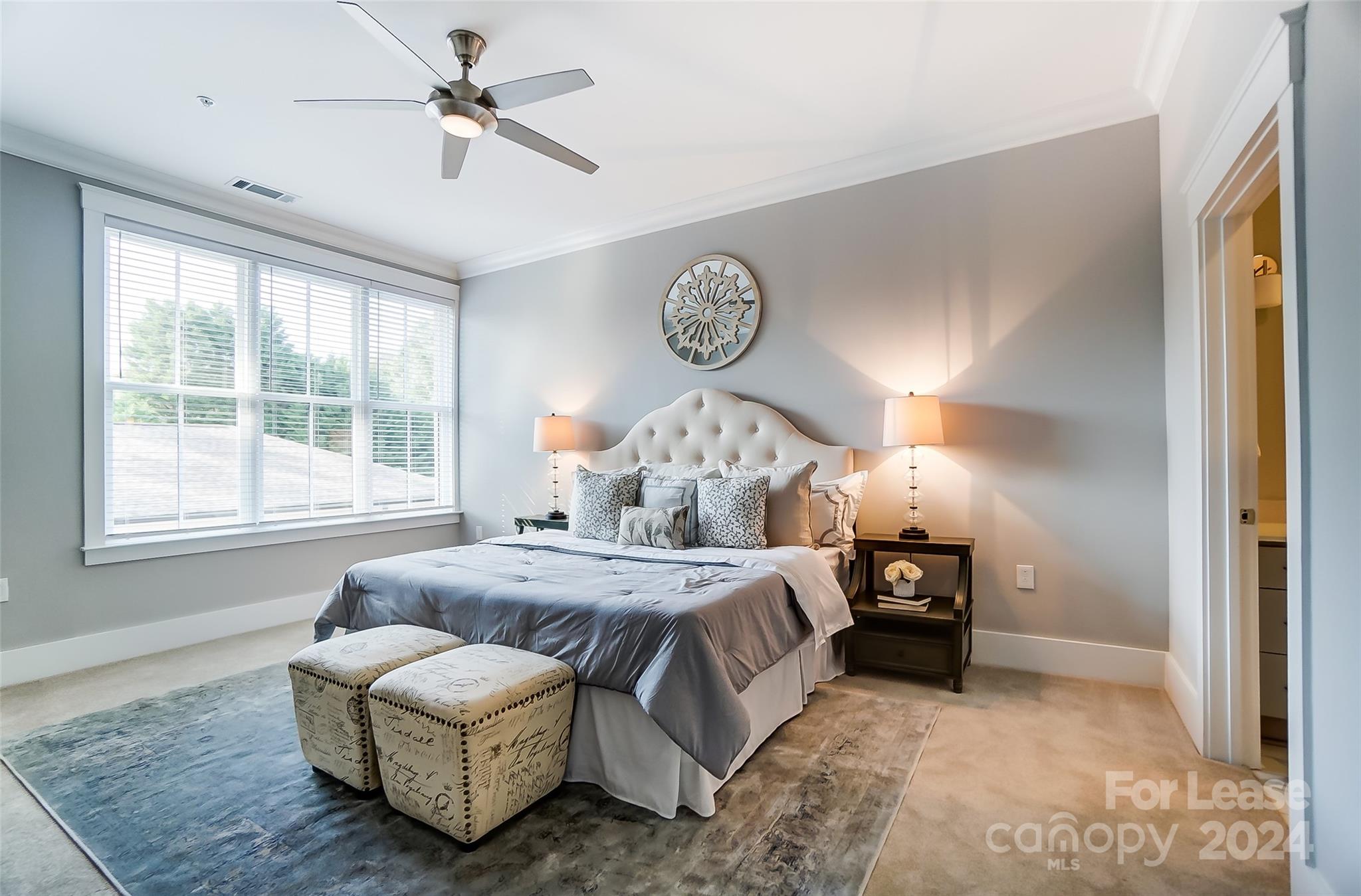 830 Providence Road, Unit 401 Charlotte, NC 28207 - Photo 14 of 24 a bed room with bed and window