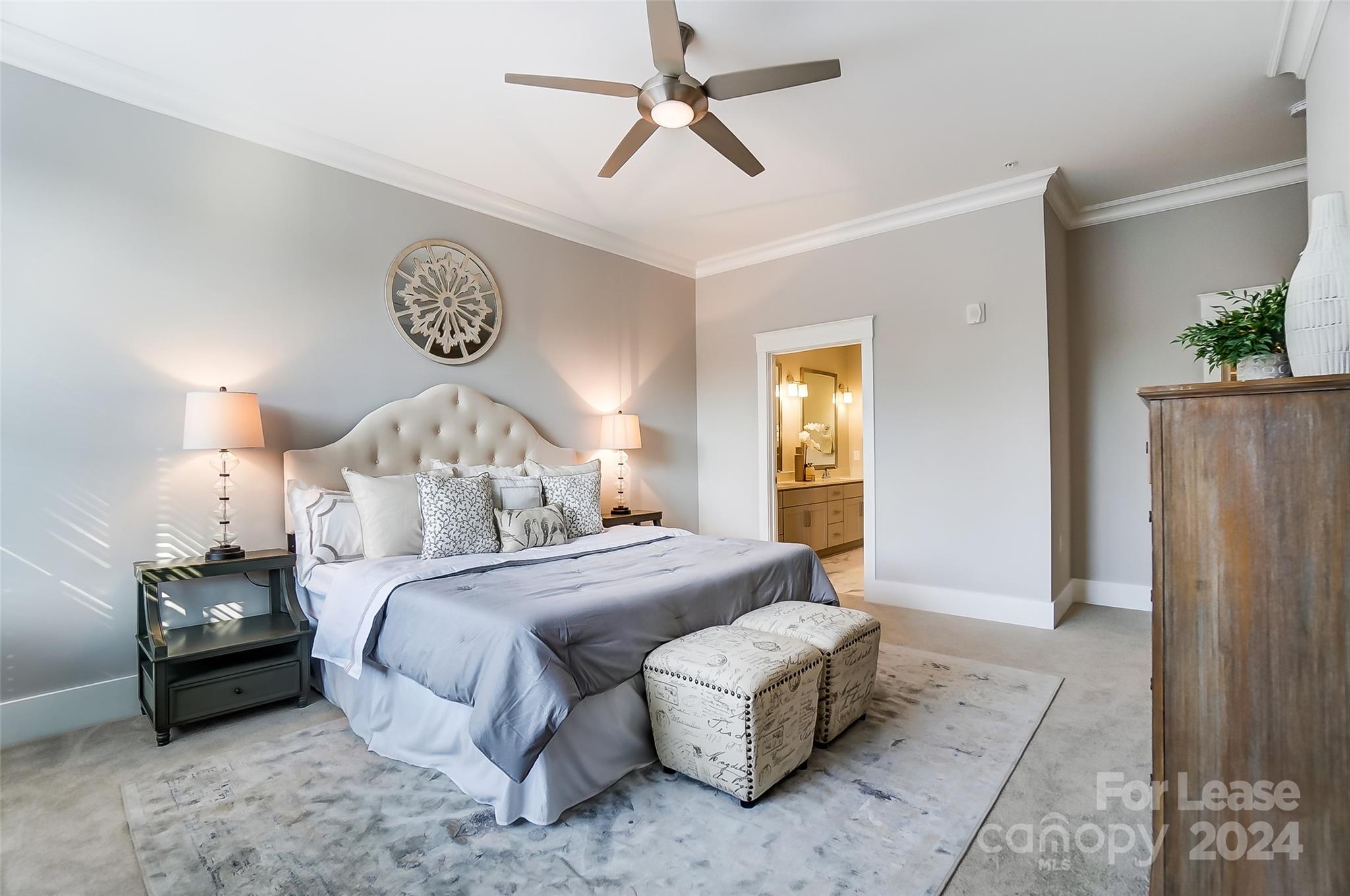 830 Providence Road, Unit 401 Charlotte, NC 28207 - Photo 15 of 24 a bedroom with a bed mirror and a window