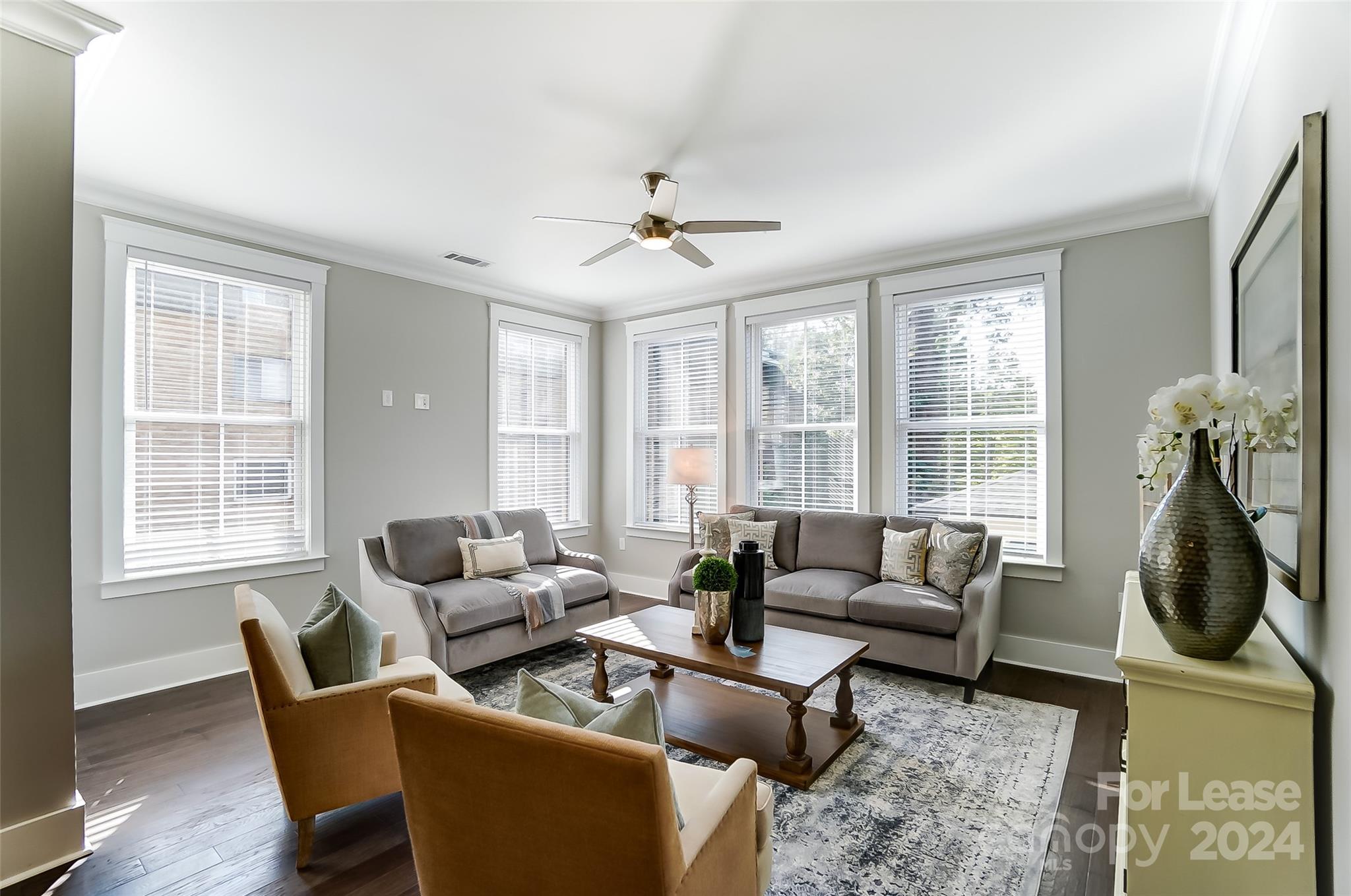 830 Providence Road, Unit 401 Charlotte, NC 28207 - Photo 4 of 24 a living room with furniture a chandelier and a window
