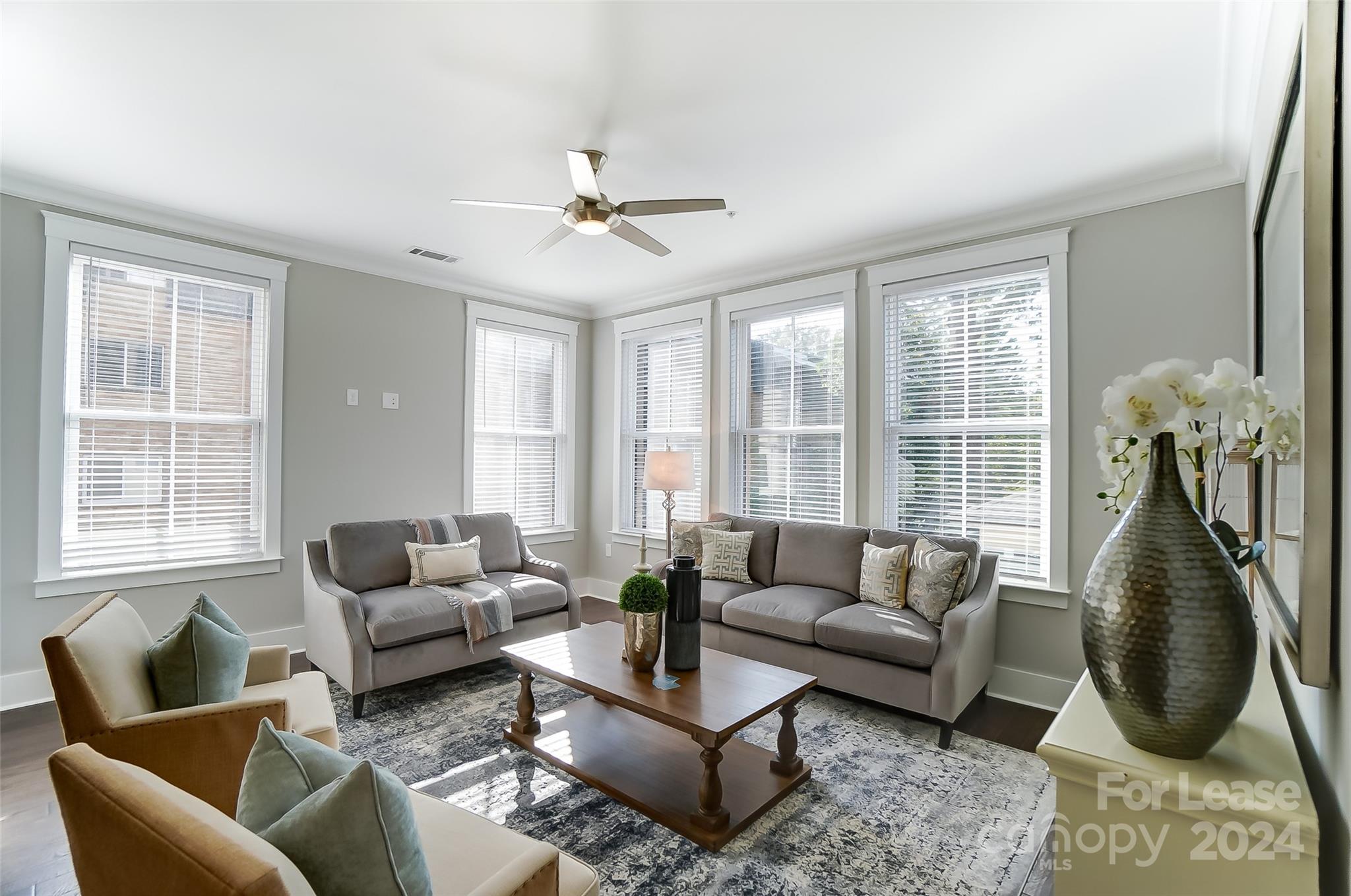 830 Providence Road, Unit 401 Charlotte, NC 28207 - Photo 5 of 24 a living room with furniture chandelier and a large window