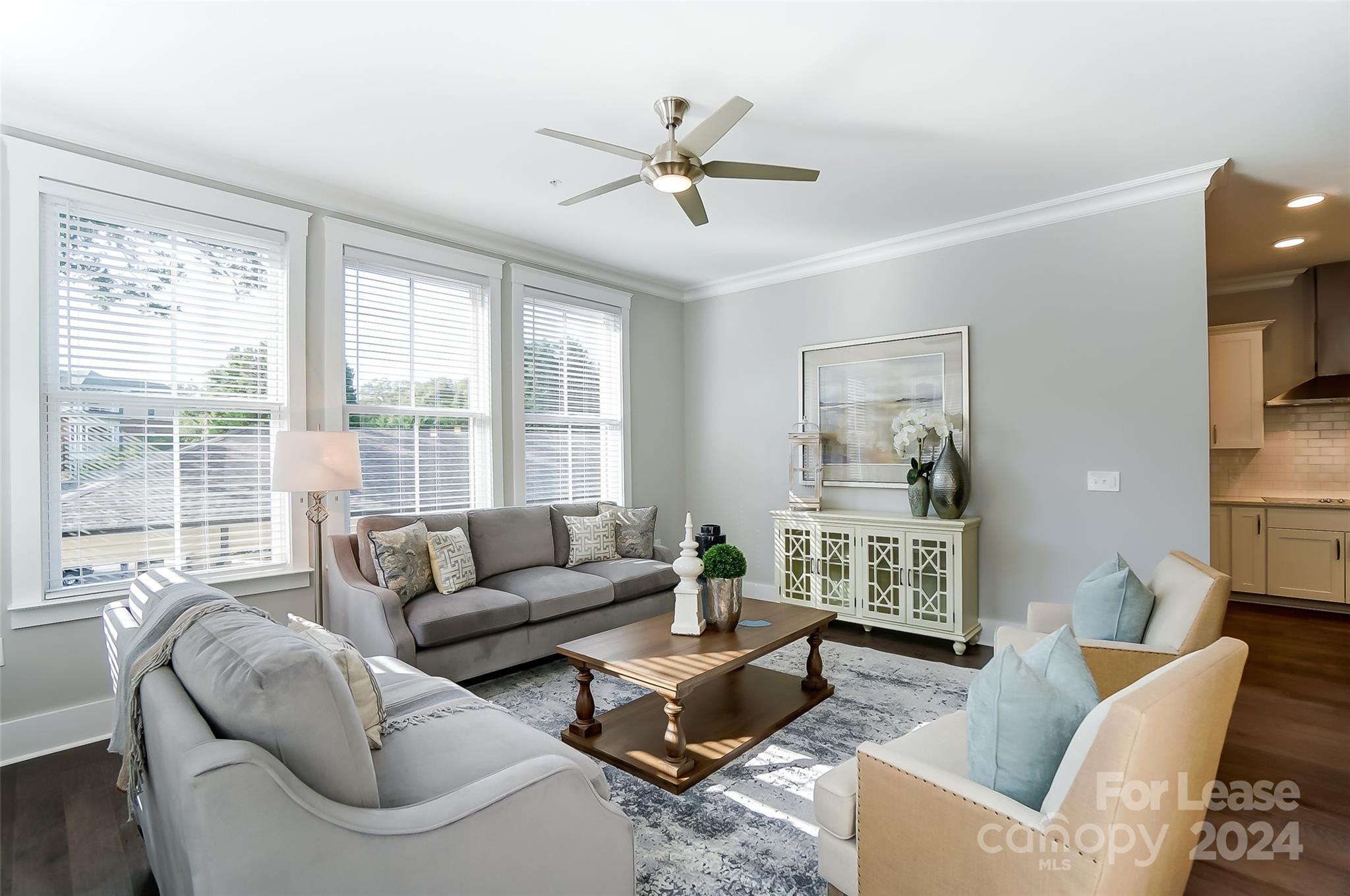 830 Providence Road, Unit 401 Charlotte, NC 28207 - Photo 6 of 24 a living room with furniture and a large window