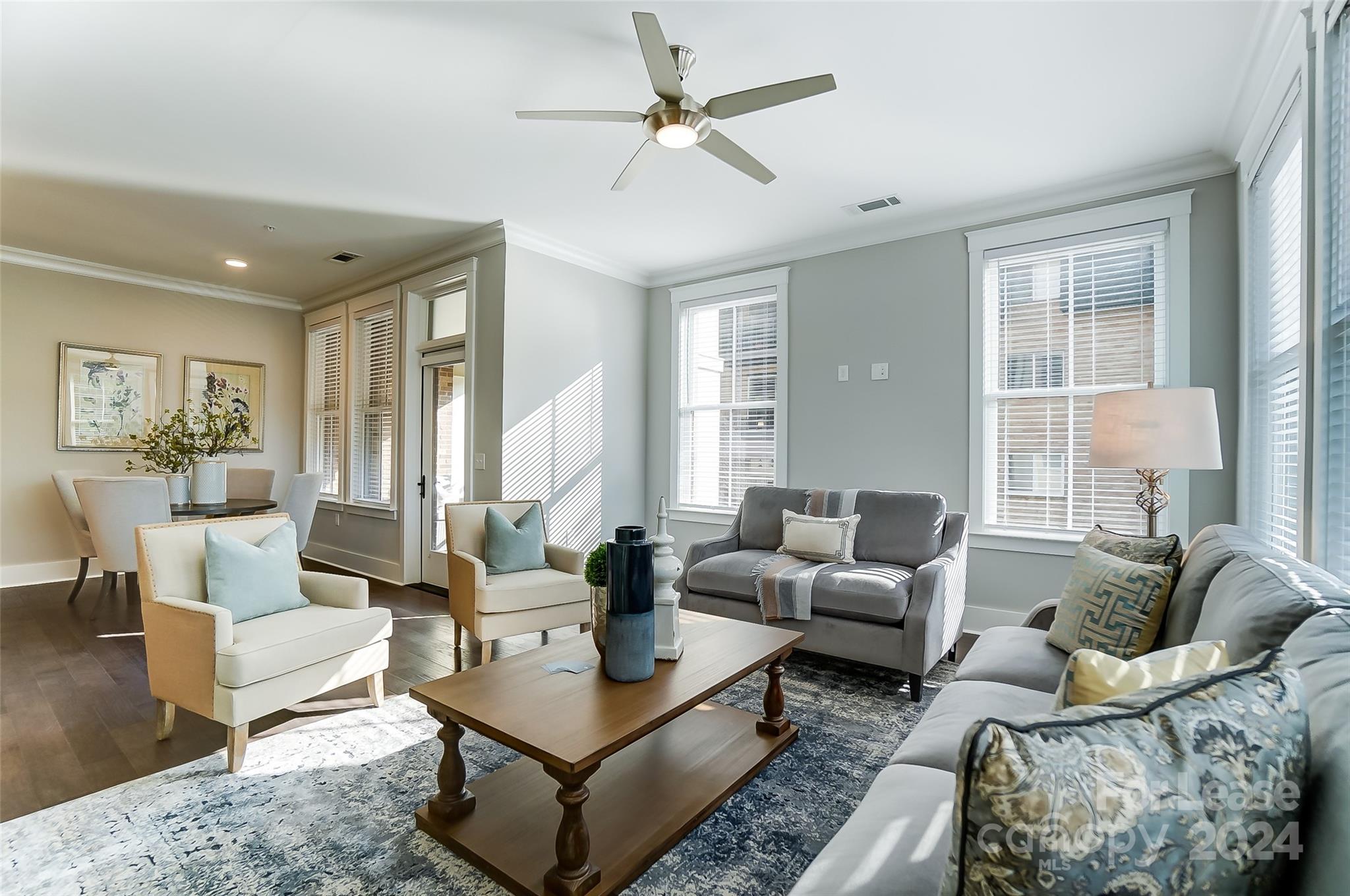 830 Providence Road, Unit 401 Charlotte, NC 28207 - Photo 7 of 24 a living room with furniture and a large window