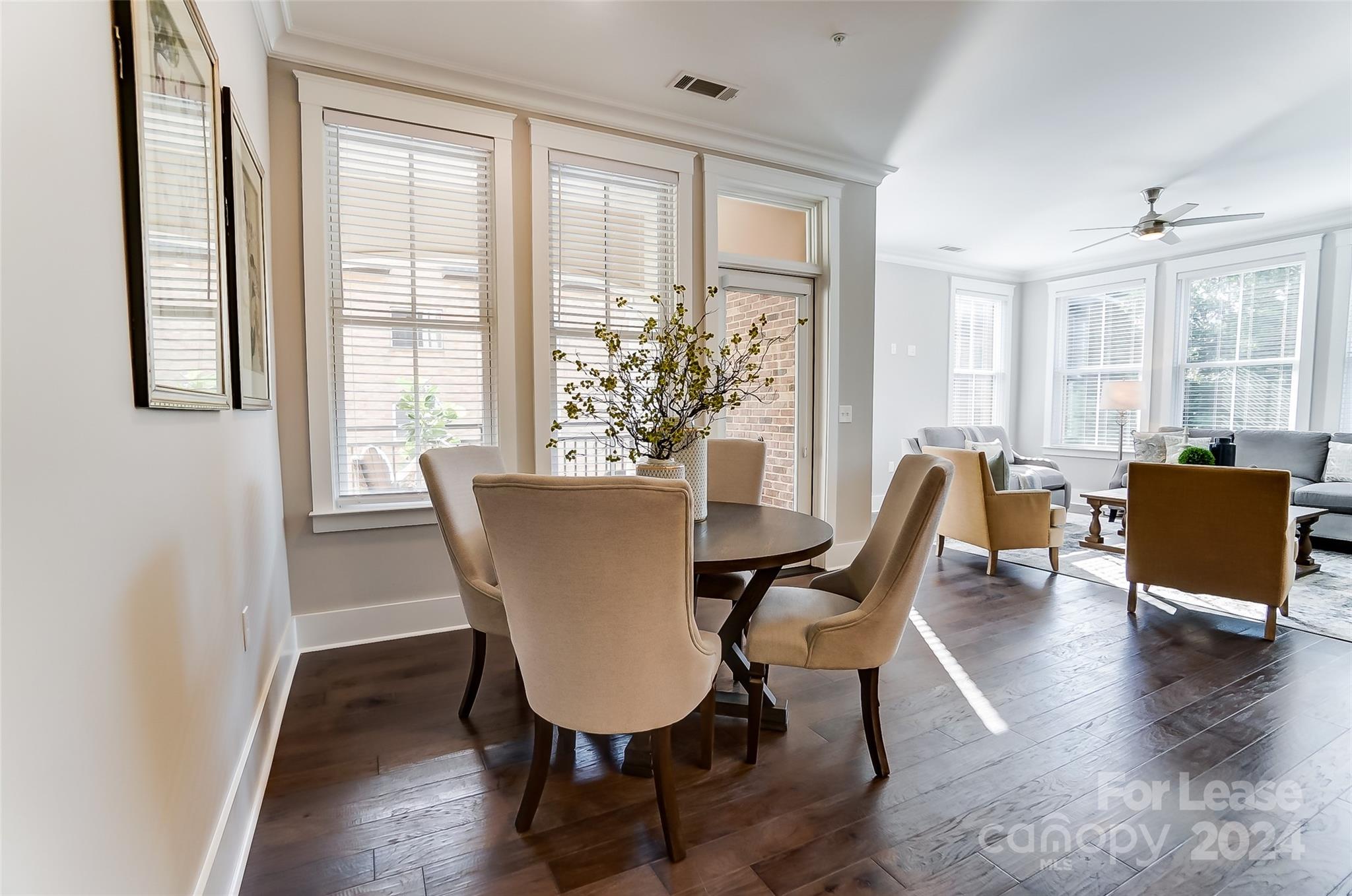 830 Providence Road, Unit 401 Charlotte, NC 28207 - Photo 10 of 24 a view of a dining room with furniture window and wooden floor