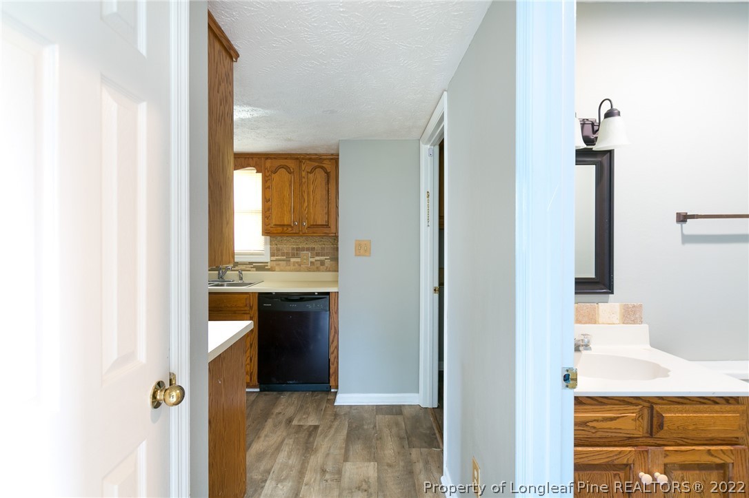 4629 Legion Road Hope Mills, NC 28348 - Photo 11 of 21 a view of a bathroom from a hallway