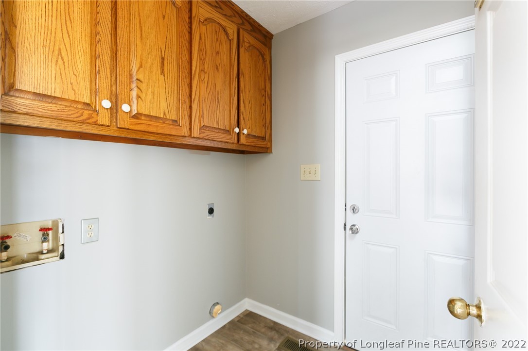 4629 Legion Road Hope Mills, NC 28348 - Photo 13 of 21 a bathroom with a sink and a mirror