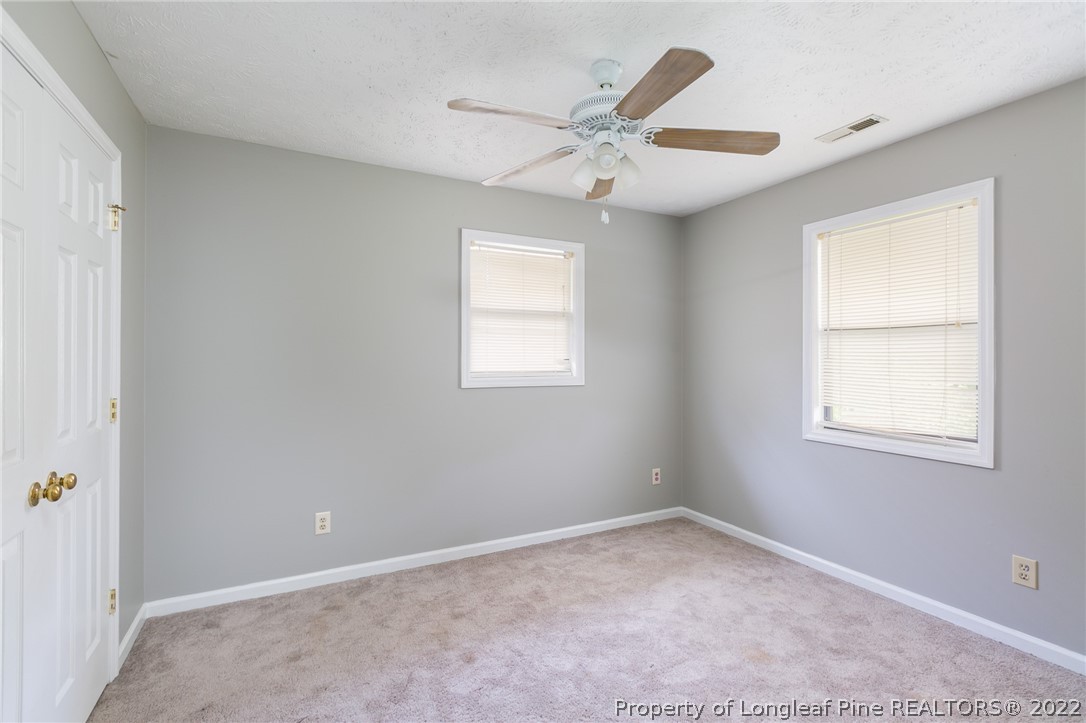 4629 Legion Road Hope Mills, NC 28348 - Photo 15 of 21 an empty room with windows and fan