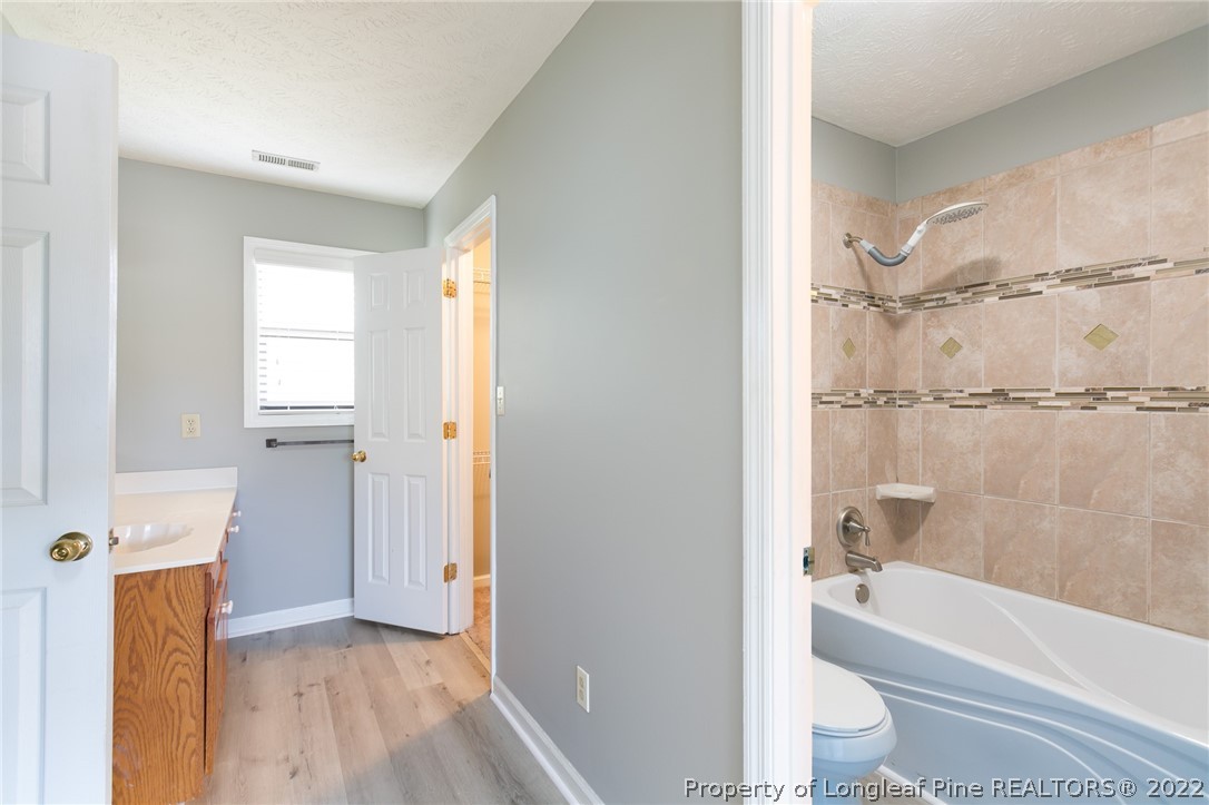 4629 Legion Road Hope Mills, NC 28348 - Photo 18 of 21 a bathroom with a bathtub toilet and sink