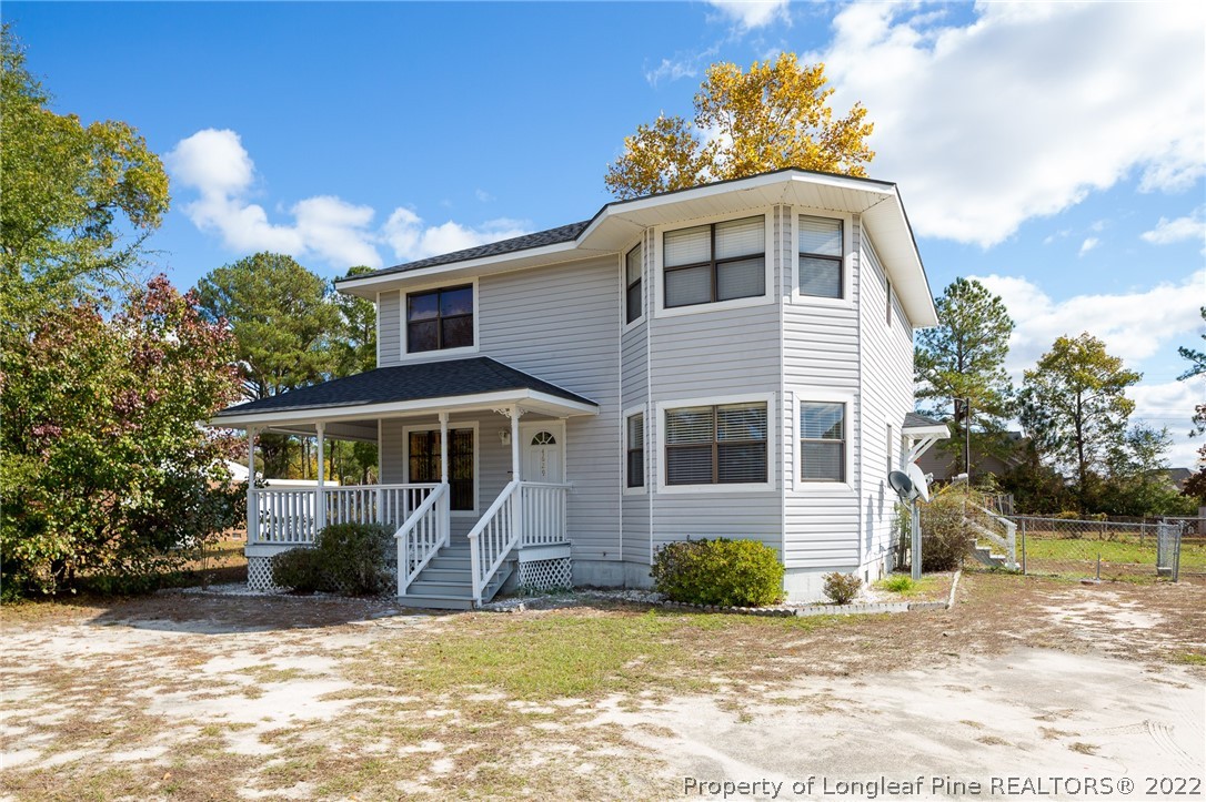 4629 Legion Road Hope Mills, NC 28348 - Photo 2 of 21 a front view of a house with a yard and garage