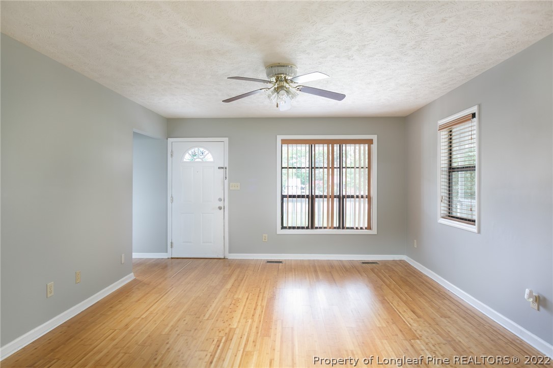 4629 Legion Road Hope Mills, NC 28348 - Photo 5 of 21 wooden floor in an empty room with a window