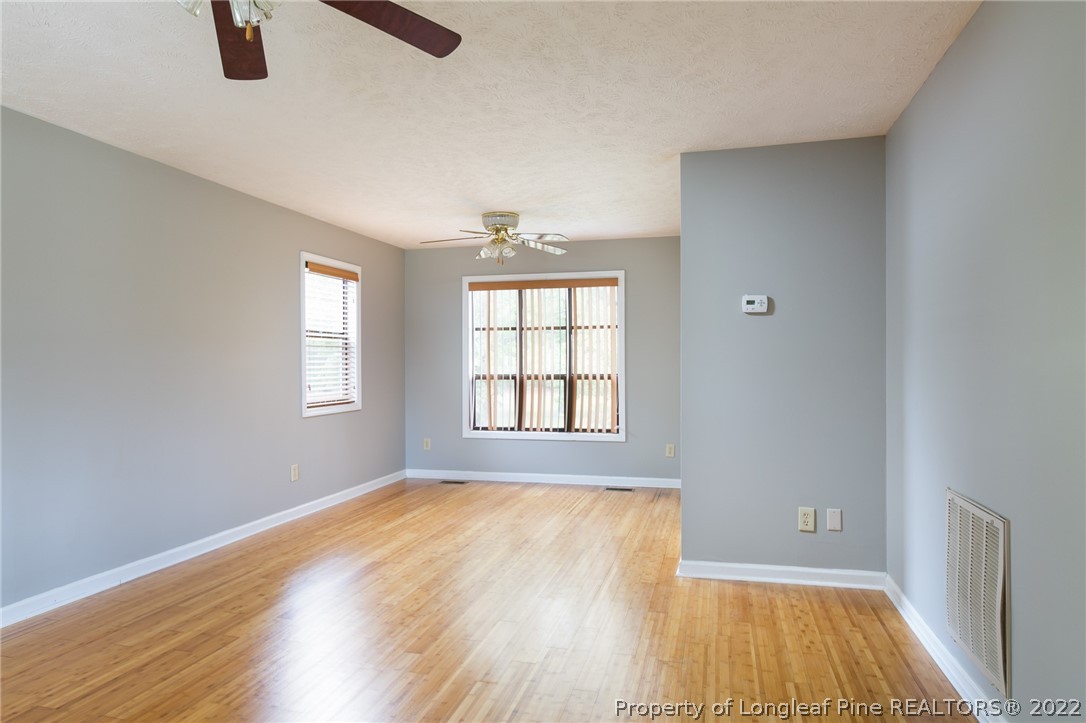4629 Legion Road Hope Mills, NC 28348 - Photo 6 of 21 a view of an empty room with window and wooden floor