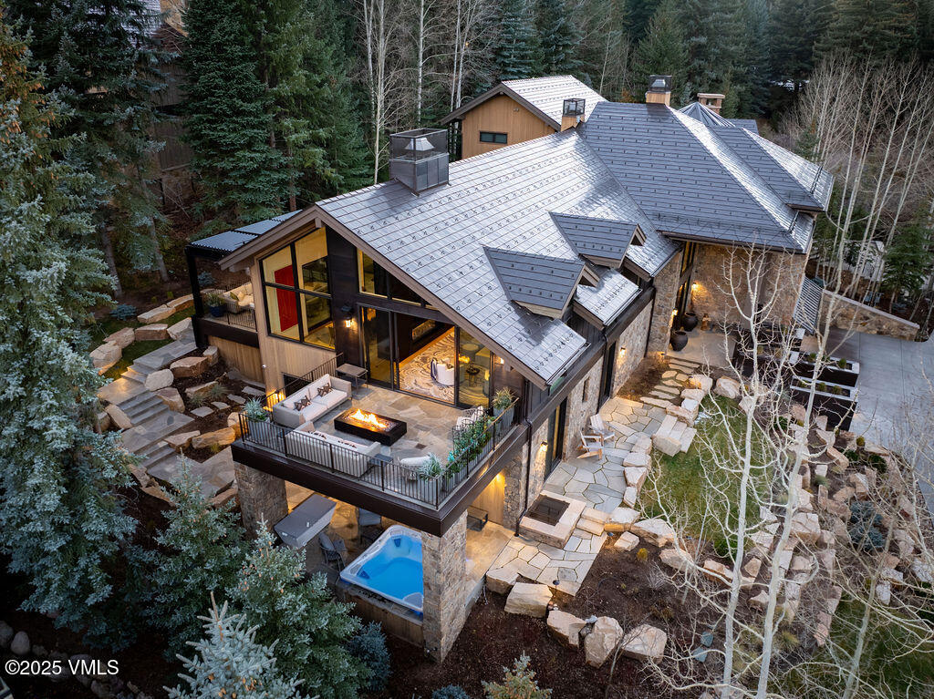 254 Beaver Dam Road Vail, CO 81657 - Photo 2 of 46 an aerial view of a house with backyard and outdoor seating