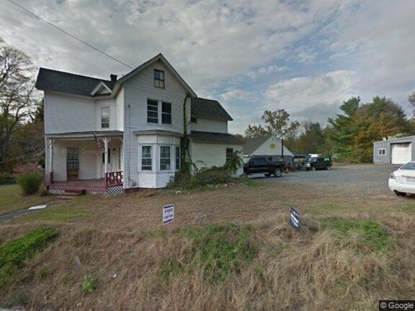 96 East Street Ware, MA 01082 - Photo 1 of 10 a front view of a house with a garden