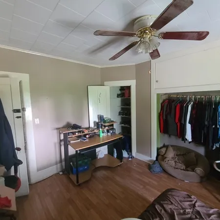 a bedroom with furniture and a gym equipment