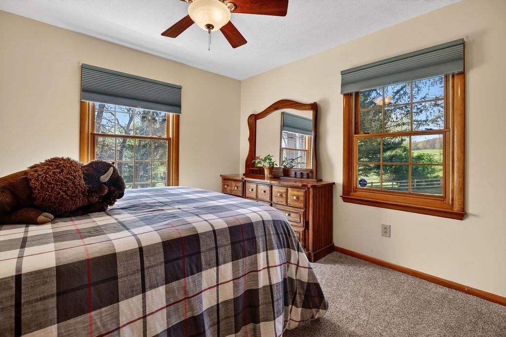 329 Red Hill Road Fairfield, VA 24435 - Photo 30 of 74 a bedroom with a bed and wooden floor