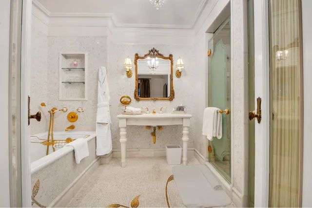 a bathroom with a sink mirror and a bathtub