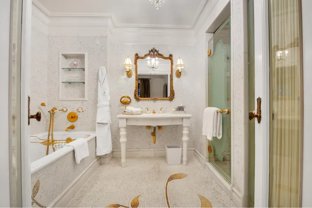 a bathroom with a sink mirror toilet and bathtub