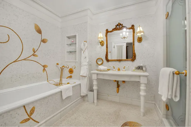 a bathroom with a sink mirror and a bathtub