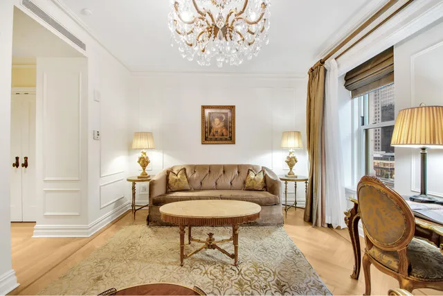 a living room with furniture and a table