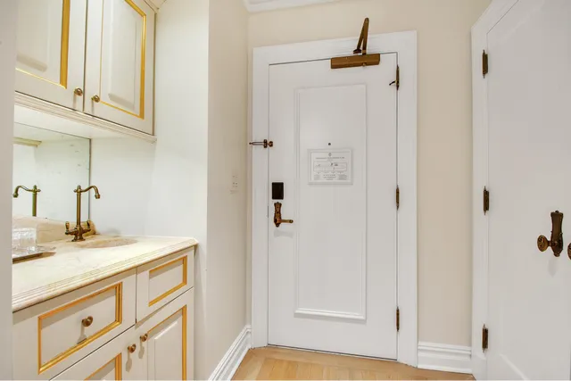 a bathroom with a granite countertop sink