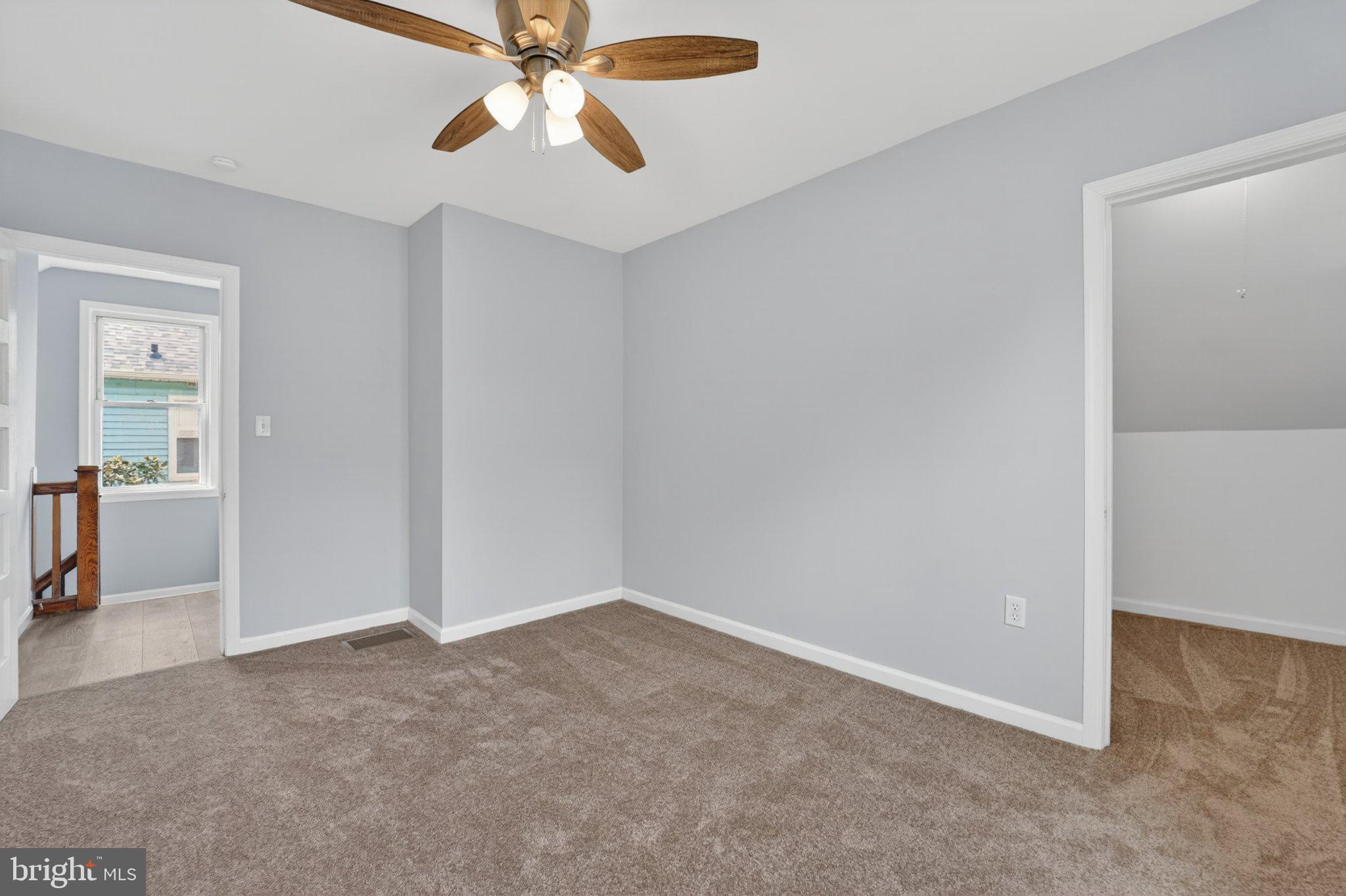 5312 Catalpha Road Baltimore, MD 21214 - Photo 53 of 59 an empty room with closet and a chandelier fan