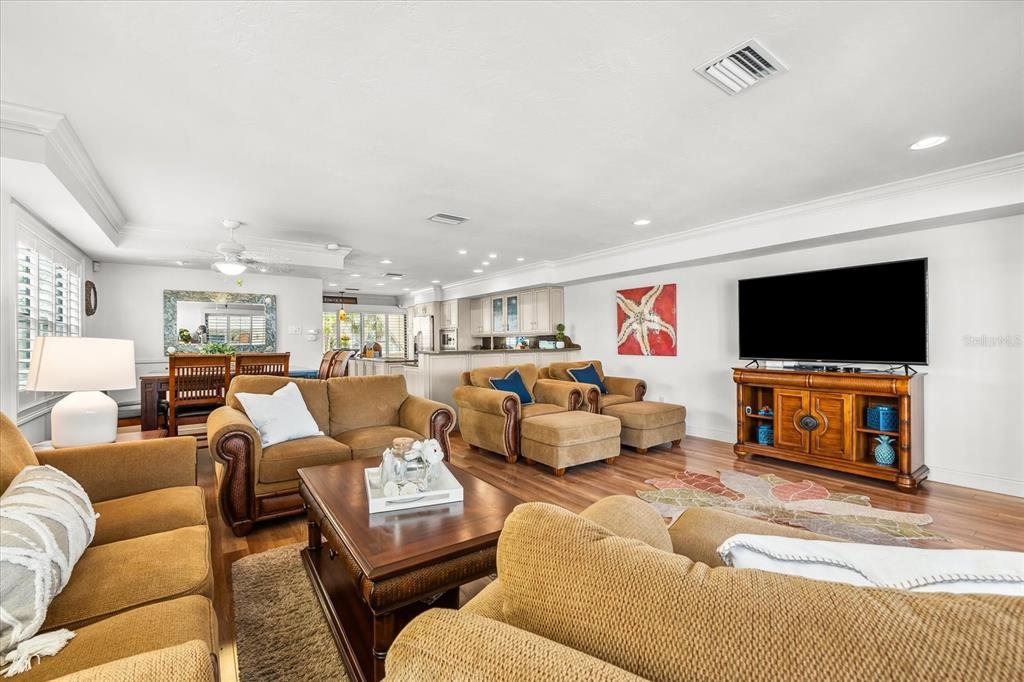 548 Beach Road, Unit 540A Sarasota, FL 34242 - Photo 14 of 77 a living room with furniture and a flat screen tv