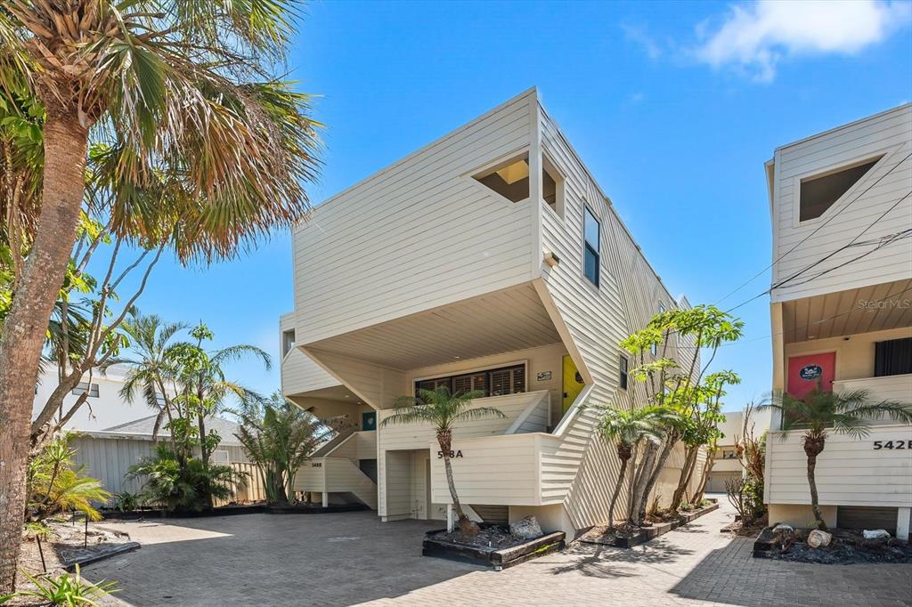 548 Beach Road, Unit 540A Sarasota, FL 34242 - Photo 2 of 77 a front view of house with yard and seating
