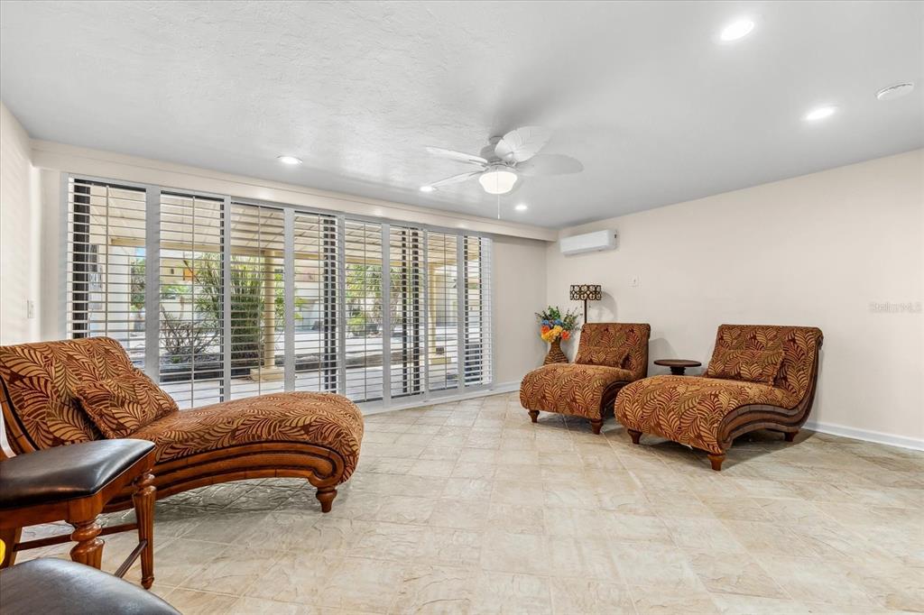 548 Beach Road, Unit 540A Sarasota, FL 34242 - Photo 33 of 77 a bedroom with furniture and a large window