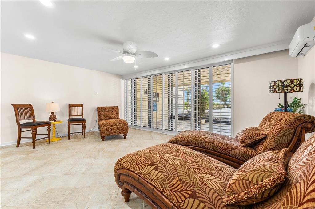 548 Beach Road, Unit 540A Sarasota, FL 34242 - Photo 34 of 77 a bedroom with a bed and a large window