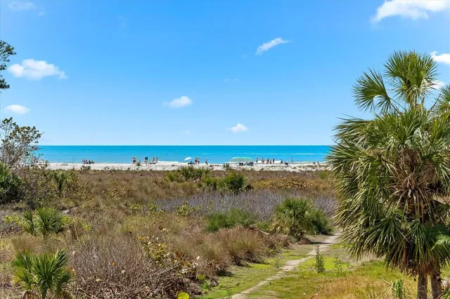 an aerial view of residential building and ocean