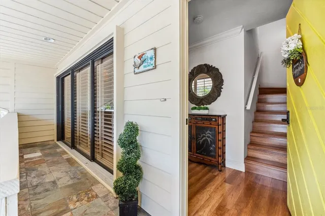 a view of entryway with wooden floor