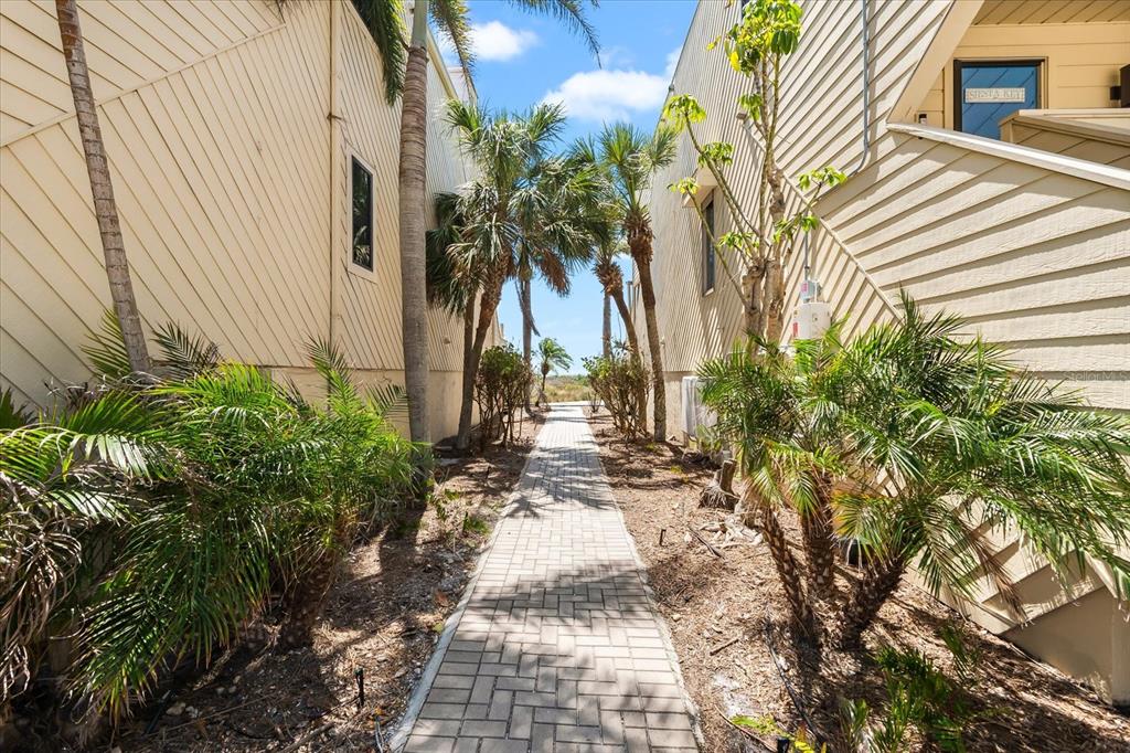 548 Beach Road, Unit 540A Sarasota, FL 34242 - Photo 42 of 77 a view of a pathway with a yard