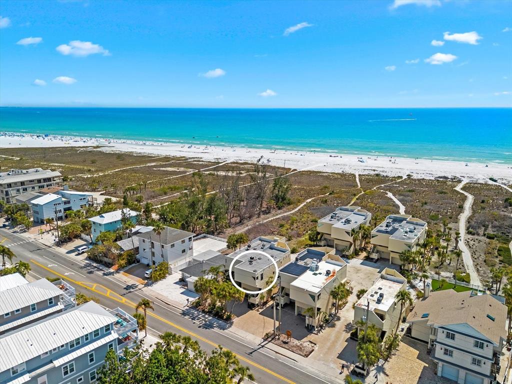 548 Beach Road, Unit 540A Sarasota, FL 34242 - Photo 50 of 77 an aerial view of ocean and residential houses with outdoor space