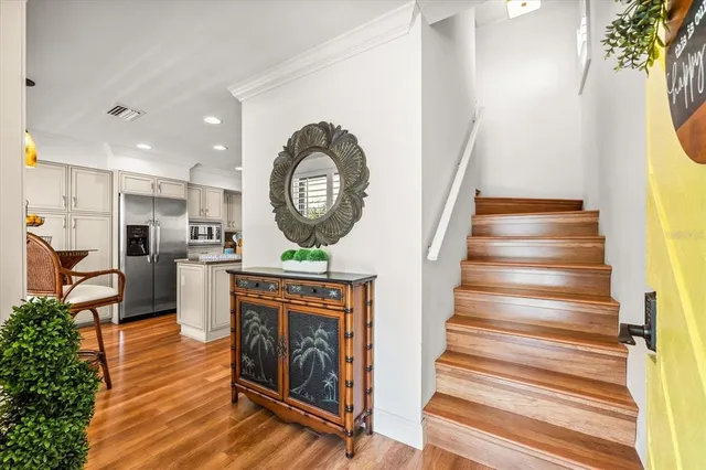 a kitchen with stainless steel appliances granite countertop a refrigerator and a sink