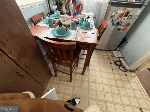a view of a dining room with furniture and rug