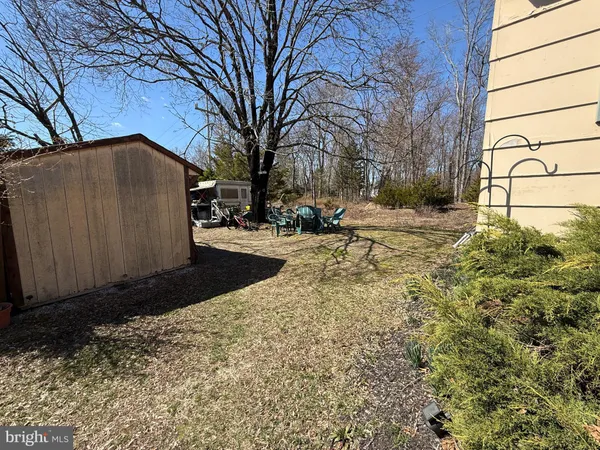 a view of a backyard of the house