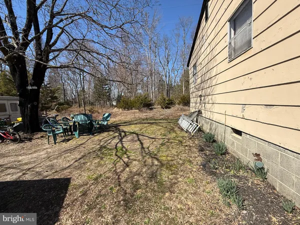 a view of a backyard of the house